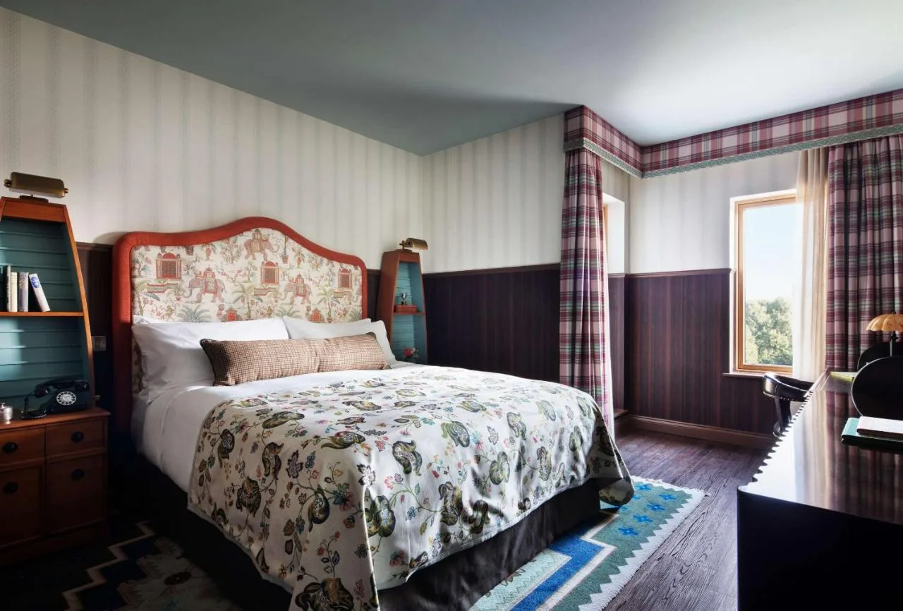 a bedroom with a large bed and a window at Graduate by Hilton Cambridge in Cambridge