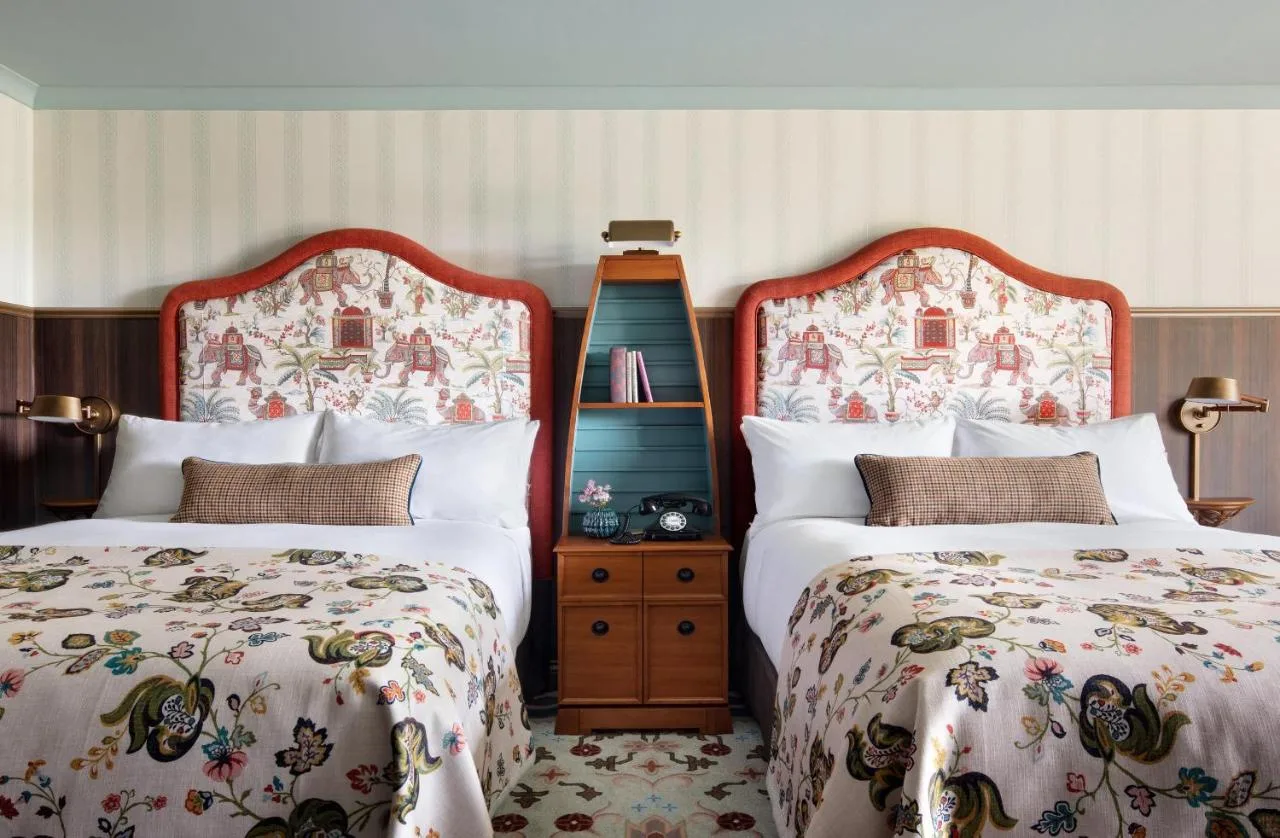 two beds sitting next to each other in a bedroom at Graduate by Hilton Cambridge in Cambridge